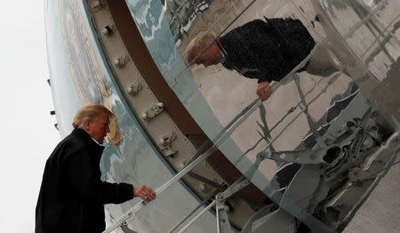 U.S. President Donald Trump boards Air Force One as he departs Joint Base Andrews in Maryland, U.S., on his way to visit areas affected by Hurricane Michael in Florida and Georgia October 15, 2018. REUTERS/Kevin Lamarque