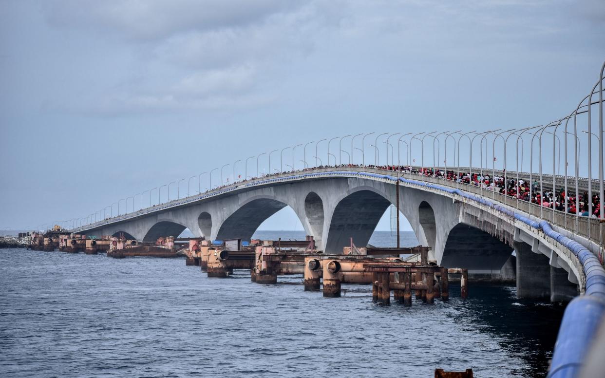 The money from India will go towards bridges and links - much like this 2018 bridge near the Maldives' capital, Male, built with Chinese funding  - AFP