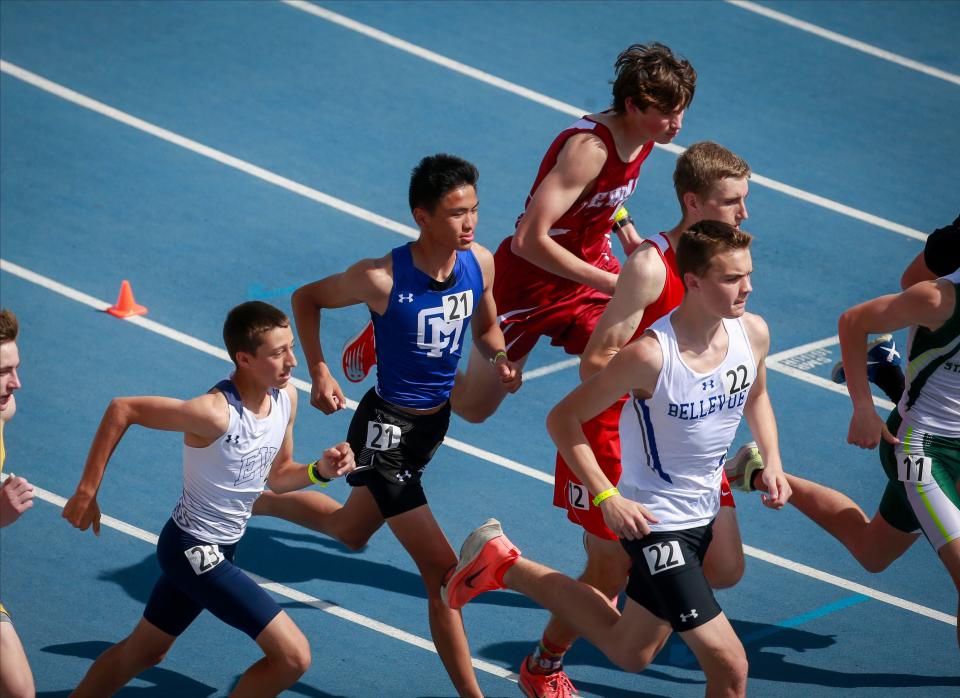 Collins-Maxwell's Ethan Haus (No. 21) competes in the Class 1A boys 3200 meter run during the Iowa high school state track and field meet at Drake Stadium in Des Moines on Thursday, May 19, 2022.