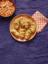 <p>You're wearing a costume, so why shouldn't your food, too? Transform your cheesy jalapeño poppers into little mummy bites. </p><p>Get the <strong><a href="https://www.womansday.com/food-recipes/food-drinks/recipes/a56191/hot-pepper-mummies-recipe/" rel="nofollow noopener" target="_blank" data-ylk="slk:Mummy Jalapeño Poppers recipe;elm:context_link;itc:0;sec:content-canvas" class="link ">Mummy Jalapeño Poppers recipe</a></strong>.</p>