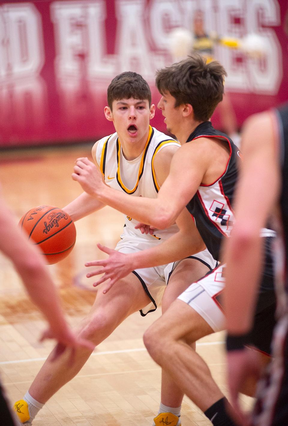 Colonel Crawford's Braxton Baker makes a move to the paint.