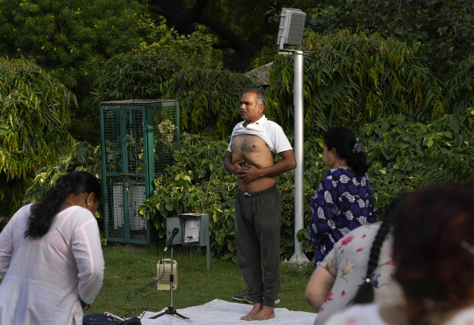 Surinder Goel, 61, conducts a yoga class early morning in a park, in New Delhi, India, Wednesday, June 14, 2023. Goel says "Our Prime Minister has done a great job in spreading yoga to the world. It was India's contribution to the world. Today, even the Muslim countries learn and follow it, only because of the PM,". He also believes yoga "is the only medium of fitness that has been there for thousands of years" and Modi's dedication towards it merits more participation from the people. (AP Photo/Manish Swarup) "Our Prime Minister has done a great job in spreading yoga to the world. It was India's contribution to the world. Today, even the Muslim countries learn and follow it, only because of the PM," says New Delhi's Surinder Goel, a 61-year-old instructor who rises before dawn and practices yoga daily. Goel believes yoga "is the only medium of fitness that has been there for thousands of years" and Modi's dedication towards it merits more participation from the people.