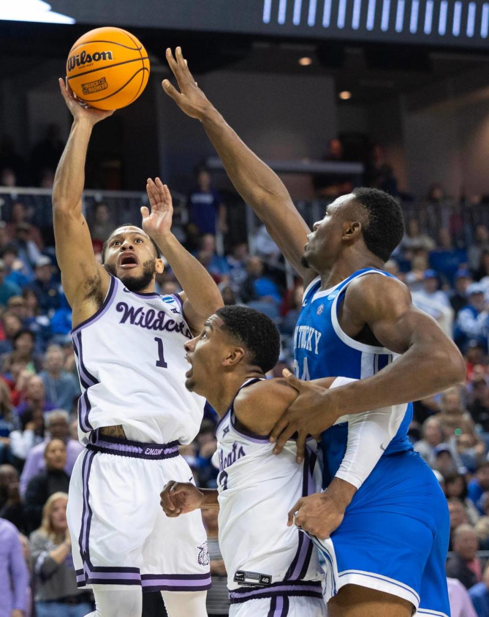 Kansas State’s Markquis Nowell gets a basket against Kentucky defender Oscar Tshiebwe during the second half of their second round NCAA Tournament game in Greensboro, NC on Sunday.