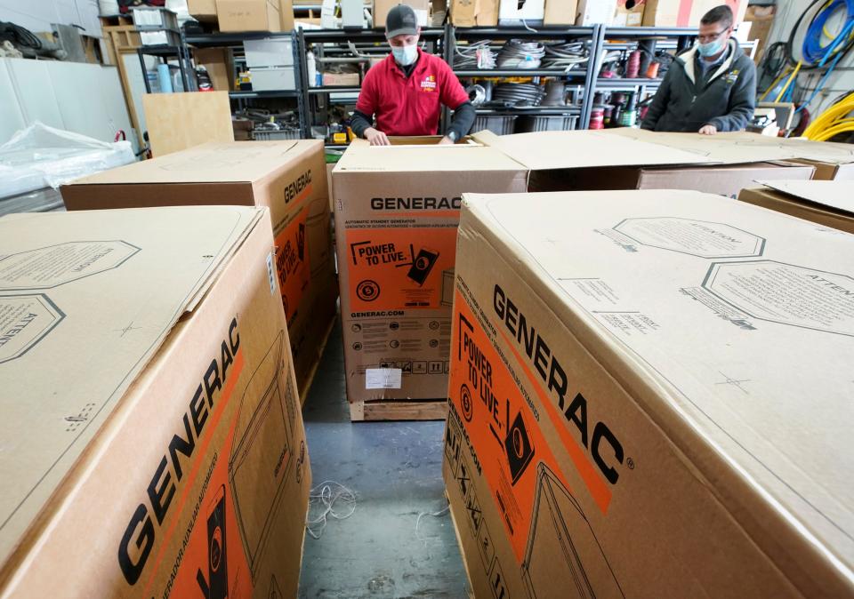 A worker inspects a 24-kilowatt Generac home generator at Captain Electric on February 18, 2021 in Orem, Utah. The company has had a surge in the purchase and installation of home generators over the last several months and currently has a four-month backlog of orders.