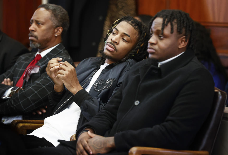 Memphis Grizzlies player Ja Morant, center, and friend Davonte Pack, right, appear in Judge Carol Chumney's courtroom at Shelby County Circuit Court Monday, Dec. 11, 2023, in Memphis, Tenn. The hearing is to determine whether Morant used self defense during a fight last summer at his home. (Mark Weber/Daily Memphian via AP)