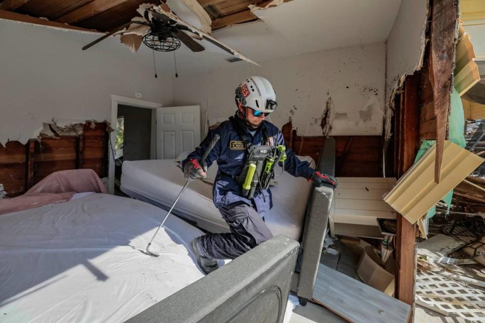 Urban Search and Rescue Florida Task Force 2 team member R. Martin searches the damaged homes on Fort Myers Beach on Monday, Oct. 3, 2022.