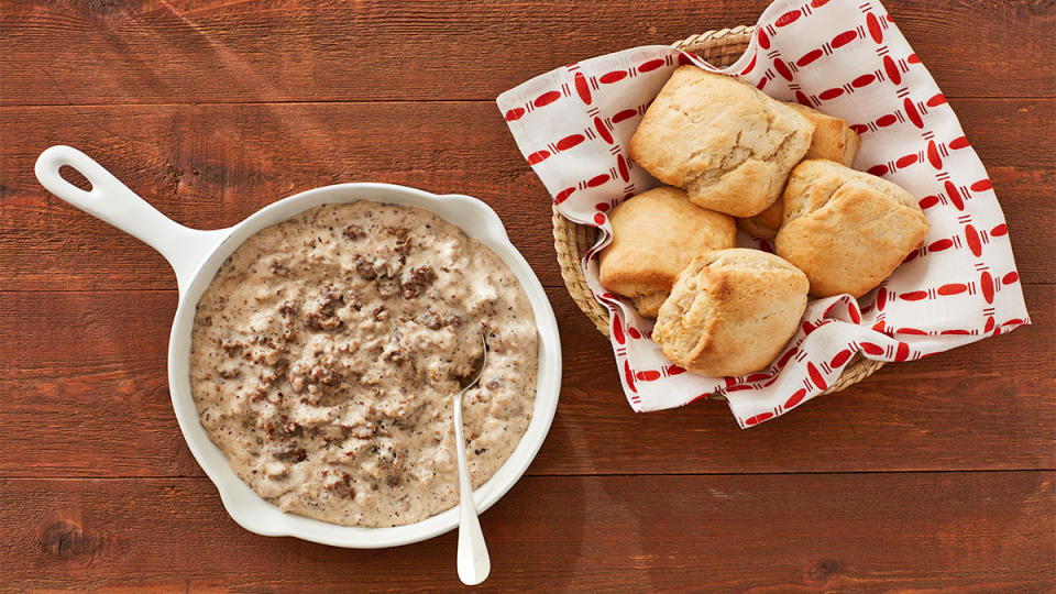 Southern biscuits and gravy served separately as part of a breakfast spread