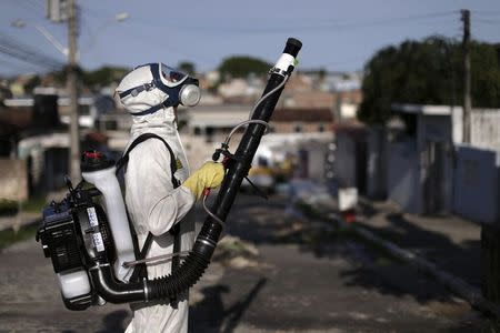 A municipal worker sprays insecticide at the neighborhood of Afogados in Recife, Brazil, February 2, 2016. The operation is part of the city's effort to prevent the spread of Zika's vector, the Aedes aegypti mosquito, according to a statement from Municipal Health Secretary. REUTERS/Ueslei Marcelino