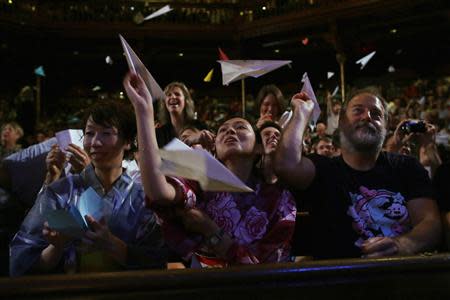 Audience members throw paper airplanes at the stage during the 23rd First Annual Ig Nobel Prize ceremony at Harvard University in Cambridge, Massachusetts September 12, 2013. REUTERS/Brian Snyder