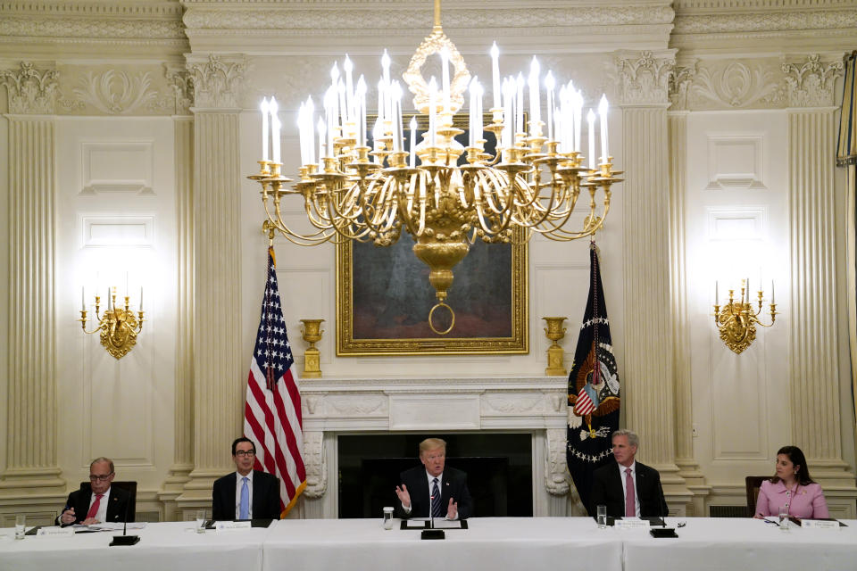 FILE - In this May 8, 2020, file photo President Donald Trump, center, speaks during a meeting with Republican lawmakers, in the State Dining Room of the White House, from left, White House chief economic adviser Larry Kudlow, Treasury Secretary Steven Mnuchin, Trump, House Minority Leader Kevin McCarthy of Calif., and Rep. Elise Stefanik, R-N.Y. Stefanik has embraced many of former President Donald Trump's evidence-free claims about 2020 election fraud. She declared this week that states unconstitutionally changed their election laws and said she supports an audit of Arizona votes that conservatives are using to bolster suspicions about the results. (AP Photo/Evan Vucci, File)