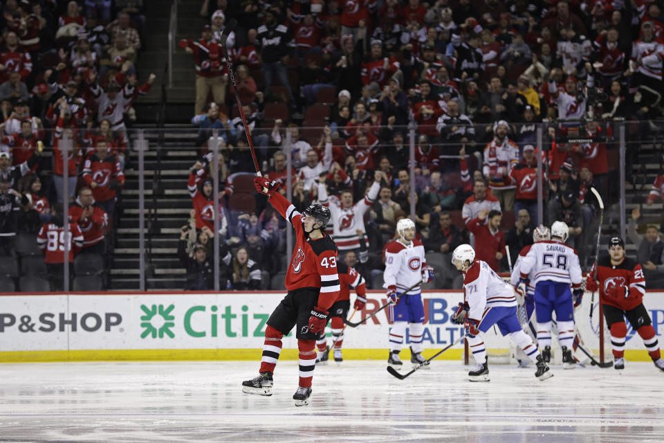 New Jersey Devils defenseman Luke Hughes (43) celebrates his goal against the Montreal Canadiens during the third period of an NHL hockey game Wednesday, Jan. 17, 2024, in Newark, N.J. (AP Photo/Adam Hunger)