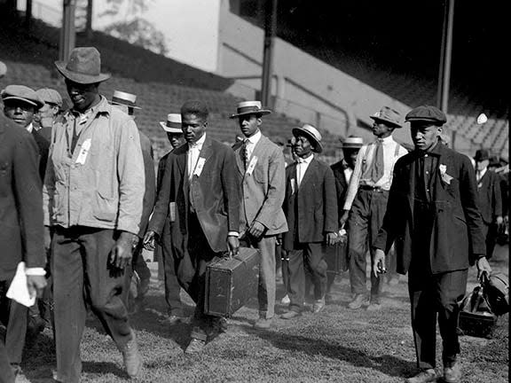 Draftees line up at Navin Field in August 1918, preparing to depart via Michigan Central Station for basic training at Camp Custer for basic training during World War I.