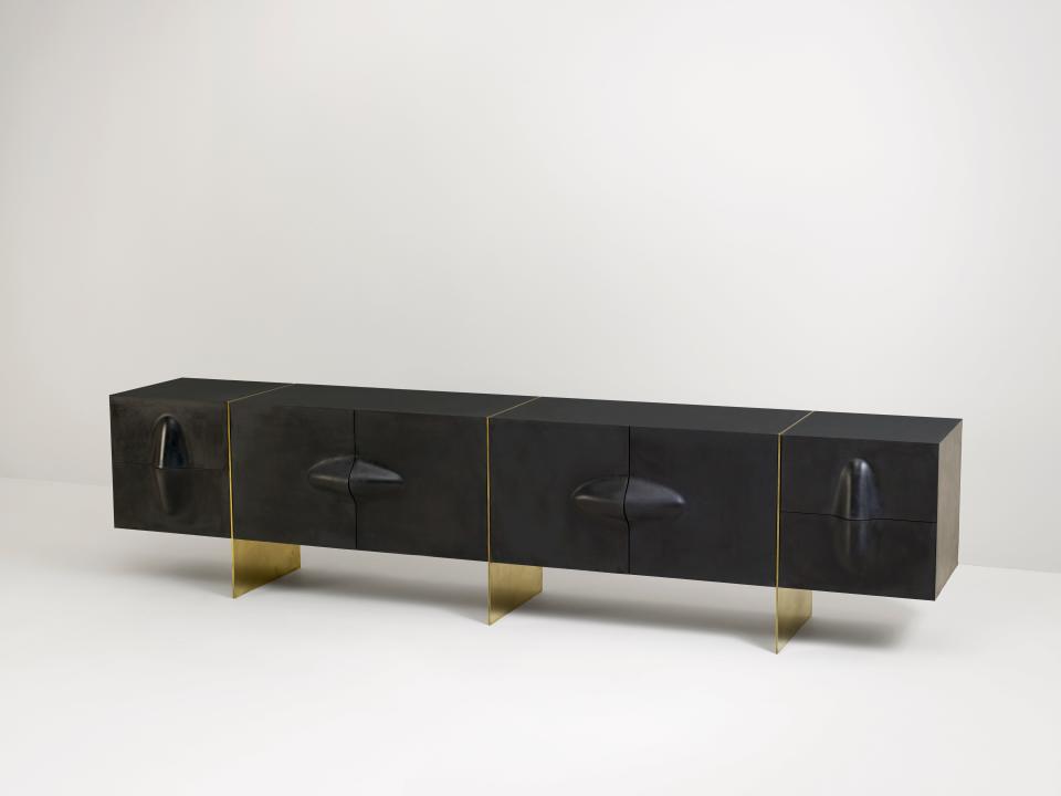 A rubber and brass console by Brian Thoreen.