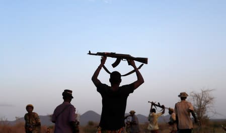 The Wider Image: When raiders menace in northern Kenya, grab your guns