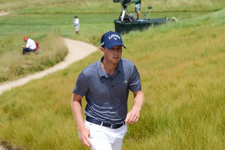 Jun 16, 2018; Southampton, NY, USA; Daniel Berger walks from the eighteenth green during the third round of the U.S. Open golf tournament at Shinnecock Hills GC - Shinnecock Hills Golf C. Mandatory Credit: Dennis Schneidler-USA TODAY Sports