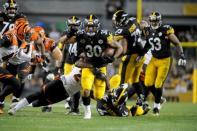 Oct 22, 2017; Pittsburgh, PA, USA; Pittsburgh Steelers running back James Conner (30) is brought down by Cincinnati Bengals cornerback Darqueze Dennard in the fourth quarter at Heinz Field. The Steelers won 29-14. Mandatory Credit: Philip G. Pavely-USA TODAY Sports