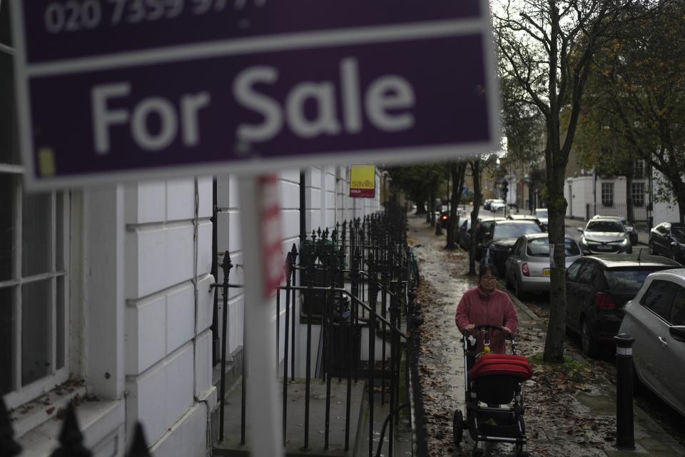 FILE - A placard shows a house for sale in London, on Nov. 3, 2022. Britain’s inflation rate rose to a 41-year high in October, fueling demands for the government to do more to ease the nation’s cost-of-living crisis when it releases new tax and spending plans on Thursday, Nov. 17, 2022. (AP Photo/Kin Cheung, File)