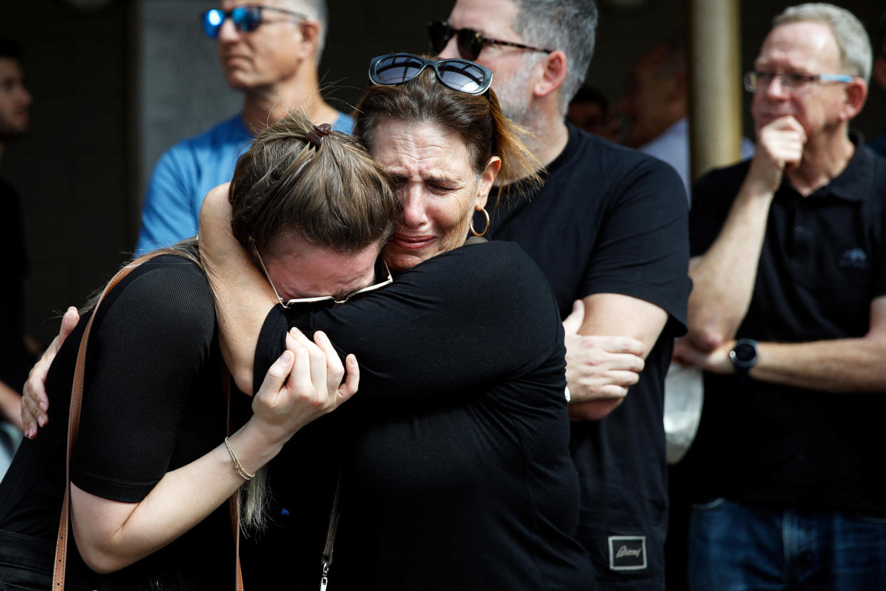 Family and friends mourn a young Israeli couple who were killed in a terrorist attack by Hamas gunmen as they attended a music festival near Gaza