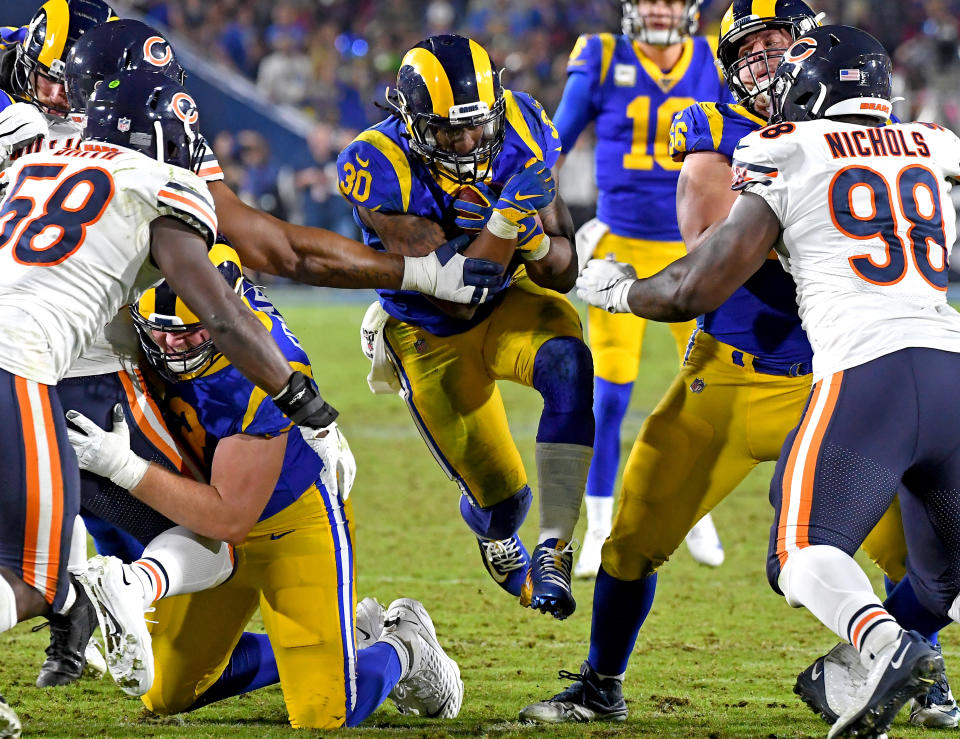 LOS ANGELES, CA - NOVEMBER 17: Running back Todd Gurley #30 of the Los Angeles Rams runs through the Chicago Bears defense in the second half of the game at the Los Angeles Memorial Coliseum on November 17, 2019 in Los Angeles, California. (Photo by Jayne Kamin-Oncea/Getty Images)