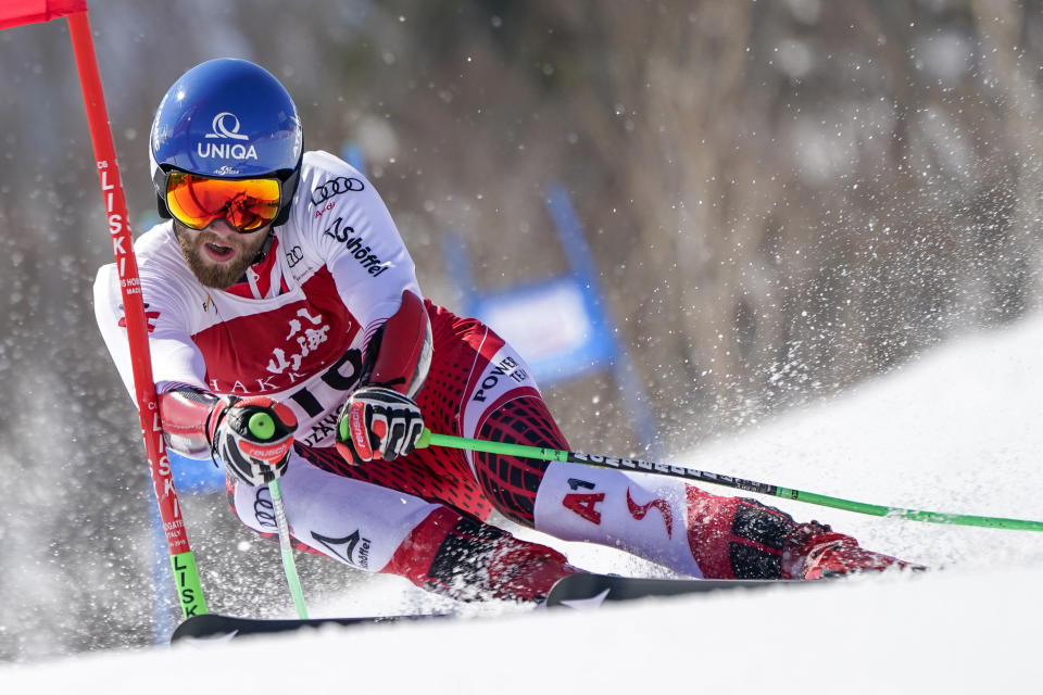 Marco Schwarz of Austria competes in the men's giant slalom during the FIS Alpine Ski World Cup at Naeba Ski Resort in Yuzawa, Niigata prefecture, northern Japan, Saturday, Feb. 22, 2020. (AP Photo/Christopher Jue)