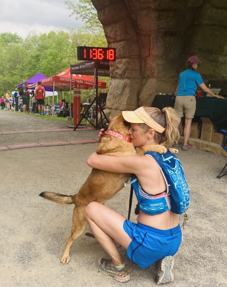 Karen Miura (pictured with her dog Lucy) finished third in the 50-59 age group at the Rock the Ridge 50-miler ultra marathon