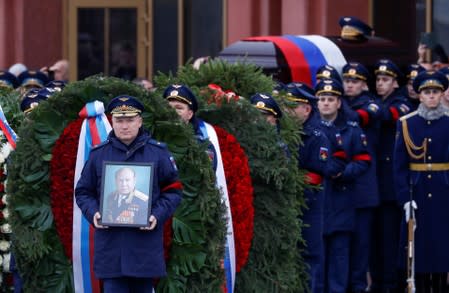 Officers carry a coffin of Alexei Leonov, the first man to conduct a space walk in 1965, during his funeral in Mytishchi, outside Moscow