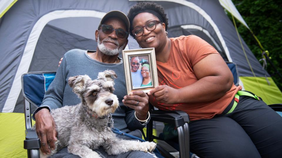 Ronald Golden and daughter Kimberly Golden, both of Camden, sit with their dog Paxton and display a photo of Ronald and Patricia Golden, Ronald's wife and Kimberly's mom, who died in 2019. This past September, Ronald and Kimberly completed their quest of visiting all 48 lower continental states in honor of Patricia Golden.