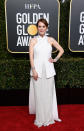 <p>Moore wore a fashion forward white ensemble by Givenchy.<br>Image via Getty Images. </p>