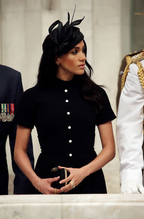 The Duke and Duchess of Sussex, Prince Harry (partially obscured) and his wife Meghan, attend the opening of the enhanced ANZAC memorial in Hyde Park, Sydney, Australia October 20, 2018. Ian Vogler/Pool via REUTERS