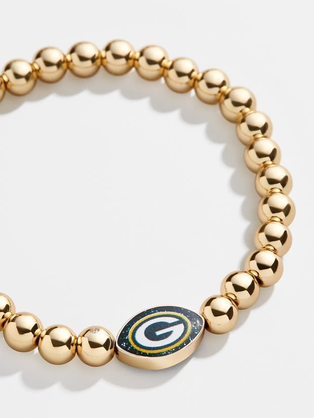 <p><a href="https://go.redirectingat.com?id=74968X1596630&url=https%3A%2F%2Fwww.baublebar.com%2Fproduct%2F58965-green-bay-packers-gold-pisa-bracelet&sref=https%3A%2F%2Fwww.seventeen.com%2Flife%2Ffriends-family%2Fg30140775%2Fgifts-for-mom-from-daughter%2F" rel="nofollow noopener" target="_blank" data-ylk="slk:Shop Now;elm:context_link;itc:0;sec:content-canvas" class="link ">Shop Now</a></p><p>Green Bay Packers Gold Pisa Bracelet</p><p>$30.00</p><p>baublebar.com</p>