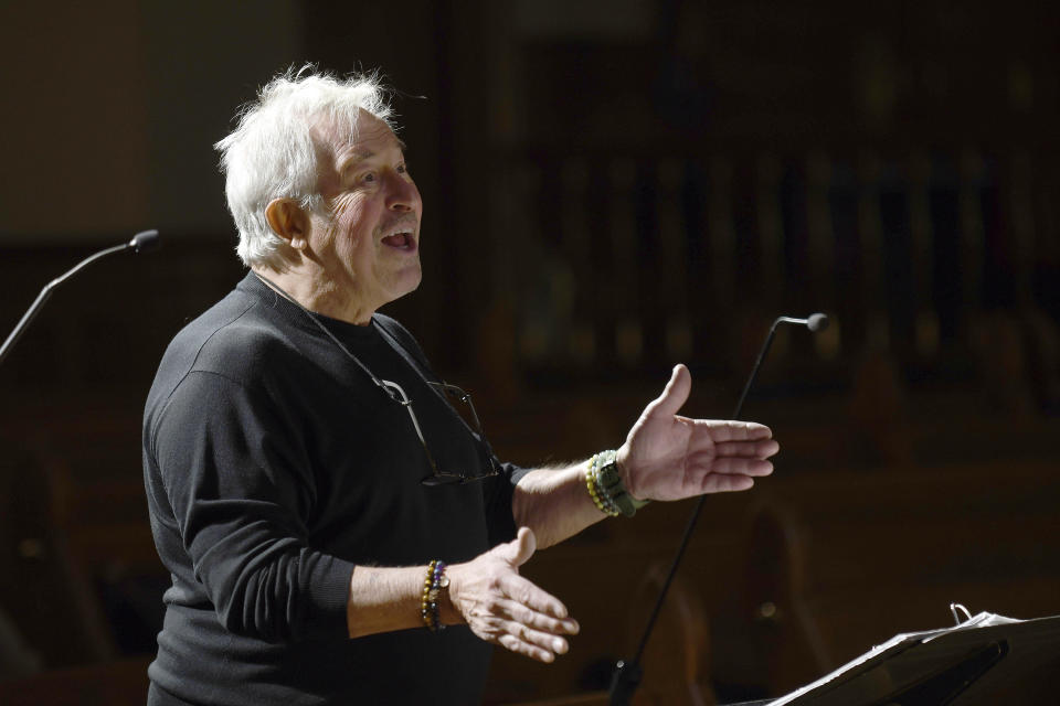 Bill Loper, interim artistic director of the Out Loud Colorado Springs Men's Chorus, leads the group during a rehearsal for its Christmas program in Colorado Springs, Colo., on Wednesday, Nov. 30, 2022. Gay and lesbian choruses like Out Loud came about after the assassination of San Francisco Supervisor Harvey Milk and have remained steadfast institutions through the civil rights struggles of the 20th century up to today. They've taken an active role in the healing process after mass shootings like that at Orlando's Pulse nightclub and the Nov. 19 attack at an LGBTQ nightclub in Colorado Springs that killed five people. (AP Photo/Thomas Peipert)