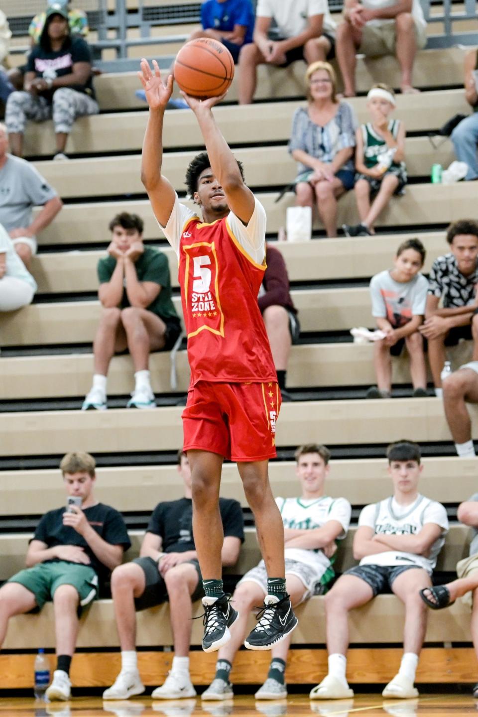 Team 5 Star Zone and MSU's Jaden Akins shoots a 3-pointer on Thursday, June 30, 2022, in the game against Team Faygo during the Moneyball Pro-Am at Holt High School.