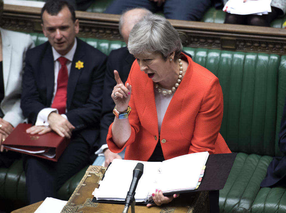 Britain's Prime Minister Theresa May speaks to lawmakers in parliament, London, Wednesday Feb. 27, 2019. May insisted Wednesday that Britain will leave the European Union on schedule next month, amid signs that her promise to give Parliament a vote on delaying Brexit was boosting support for her unpopular EU divorce deal. (Jessica Taylor/UK Parliament via AP)