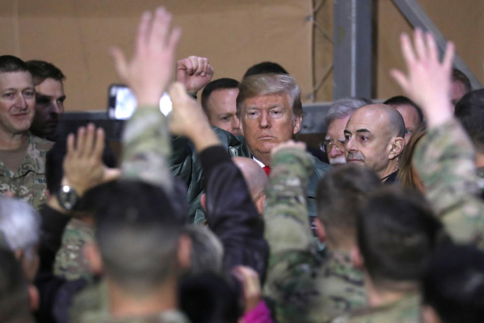 President Trump is surrounded U.S. troops during in an unannounced visit to Al Asad Air Base, Iraq, on Dec. 26, 2018. (Photo: Jonathan Ernst/Reuters)