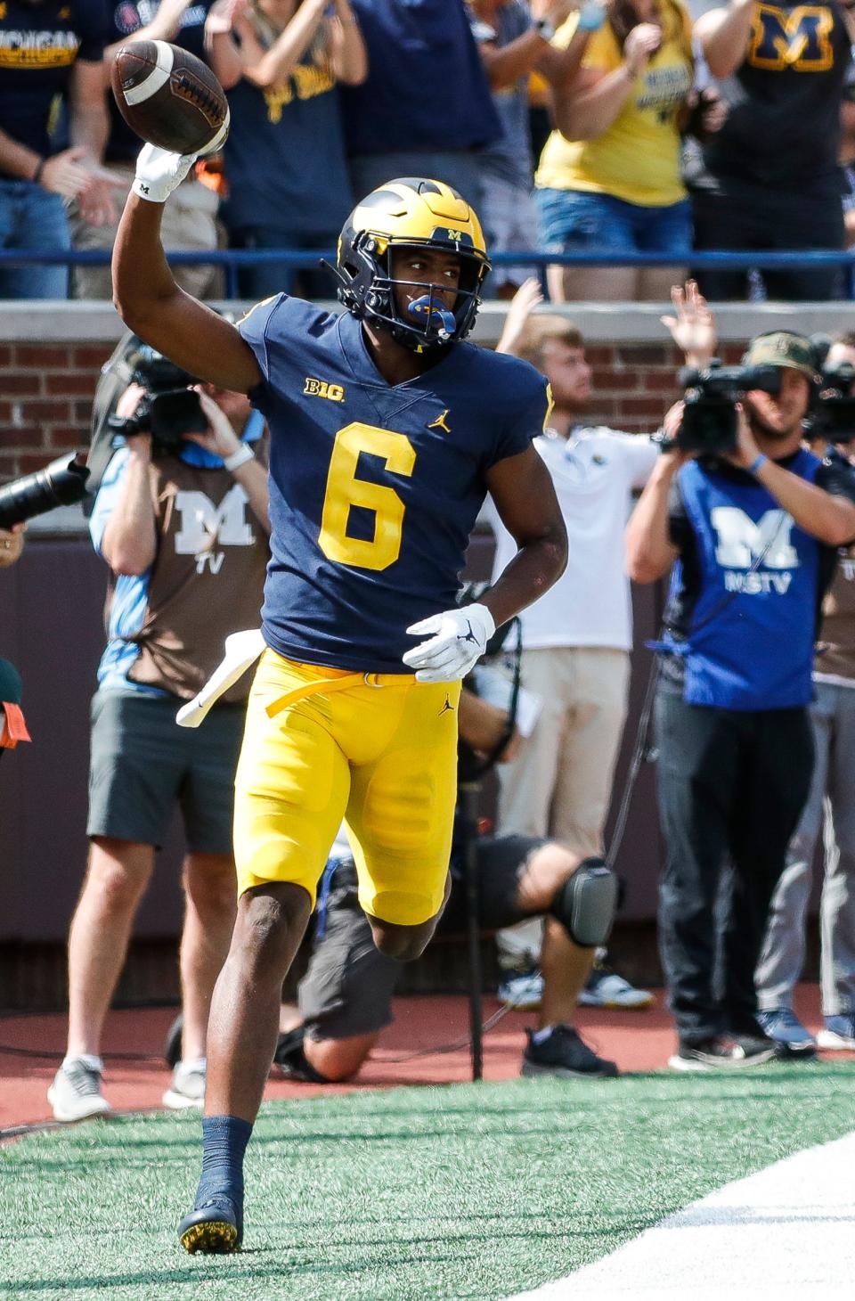 Michigan wide receiver Cornelius Johnson (6) scores a touchdown against Northern Illinois during the first half at Michigan Stadium in Ann Arbor on Saturday, Sept. 18, 2021.