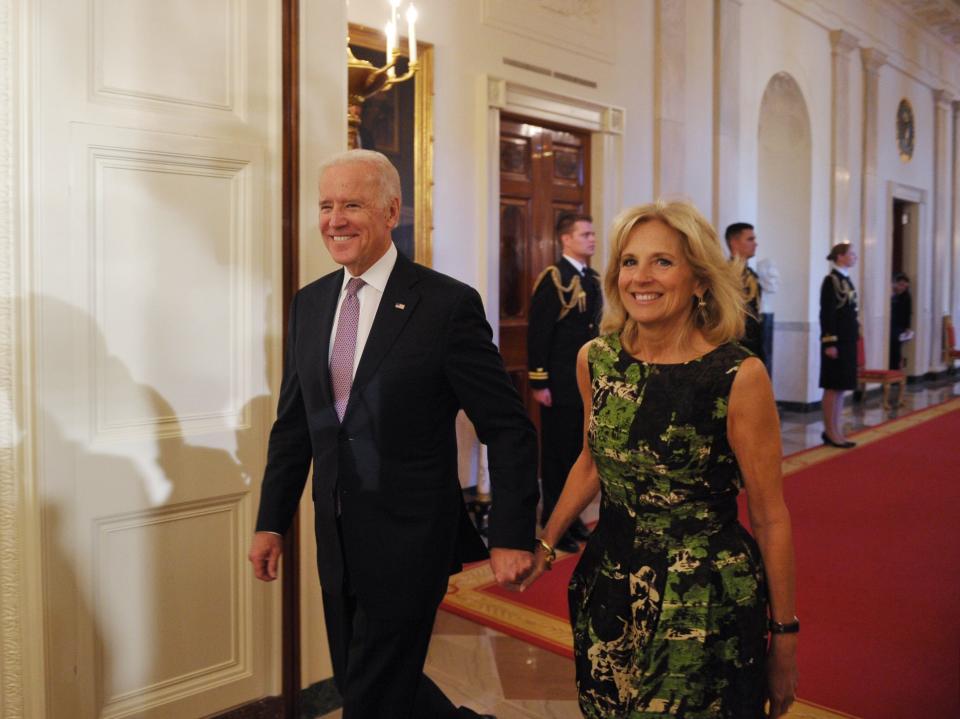 Joe Biden and Jill Biden attend a Presidential Medal of Freedom ceremony in November 2013.