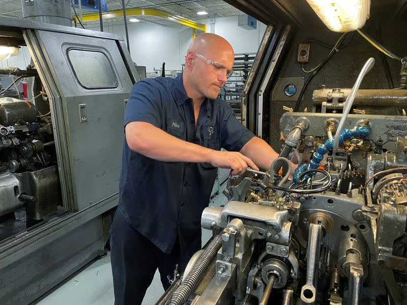 FILE PHOTO: A worker operates one of the metal cutting machines at Gent Machine Co.'s factory in Cleveland