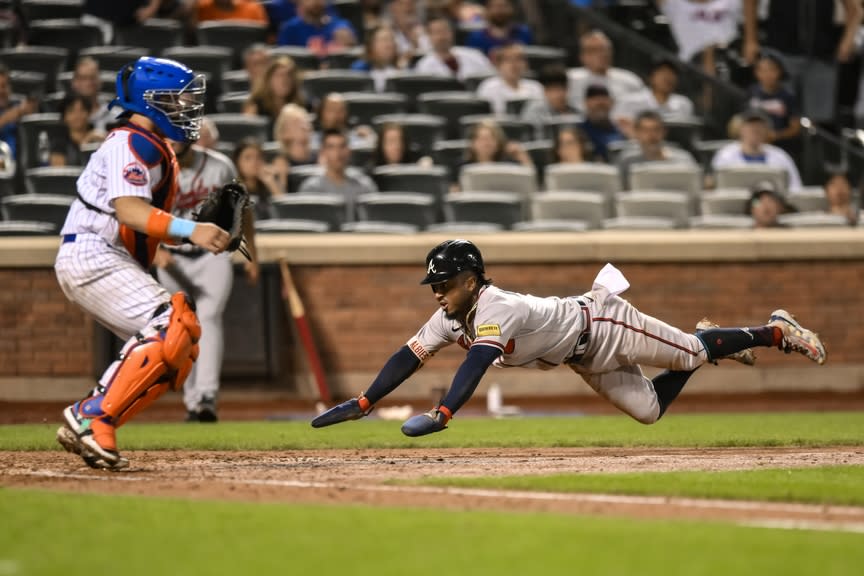 Atlanta Braves second baseman Ozzie Albies (1) scores a run on a RBI single by Atlanta Braves third baseman Austin Riley (not pictured) during the eighth inning at Citi Field.