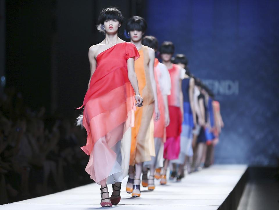 Models wear creations for Fendi women's Spring-Summer 2014 collection, part of the Milan Fashion Week, unveiled in Milan, Italy, Thursday, Sept. 19, 2013. (AP Photo/Antonio Calanni)