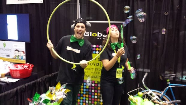 <b class="credit">Tom Siebert</b>Santiago San Martin (left) and Sasha Sadrai, recruiters for Globant, a software development company, did wacky things to get potential employees' attention at a SXSWi job fair.