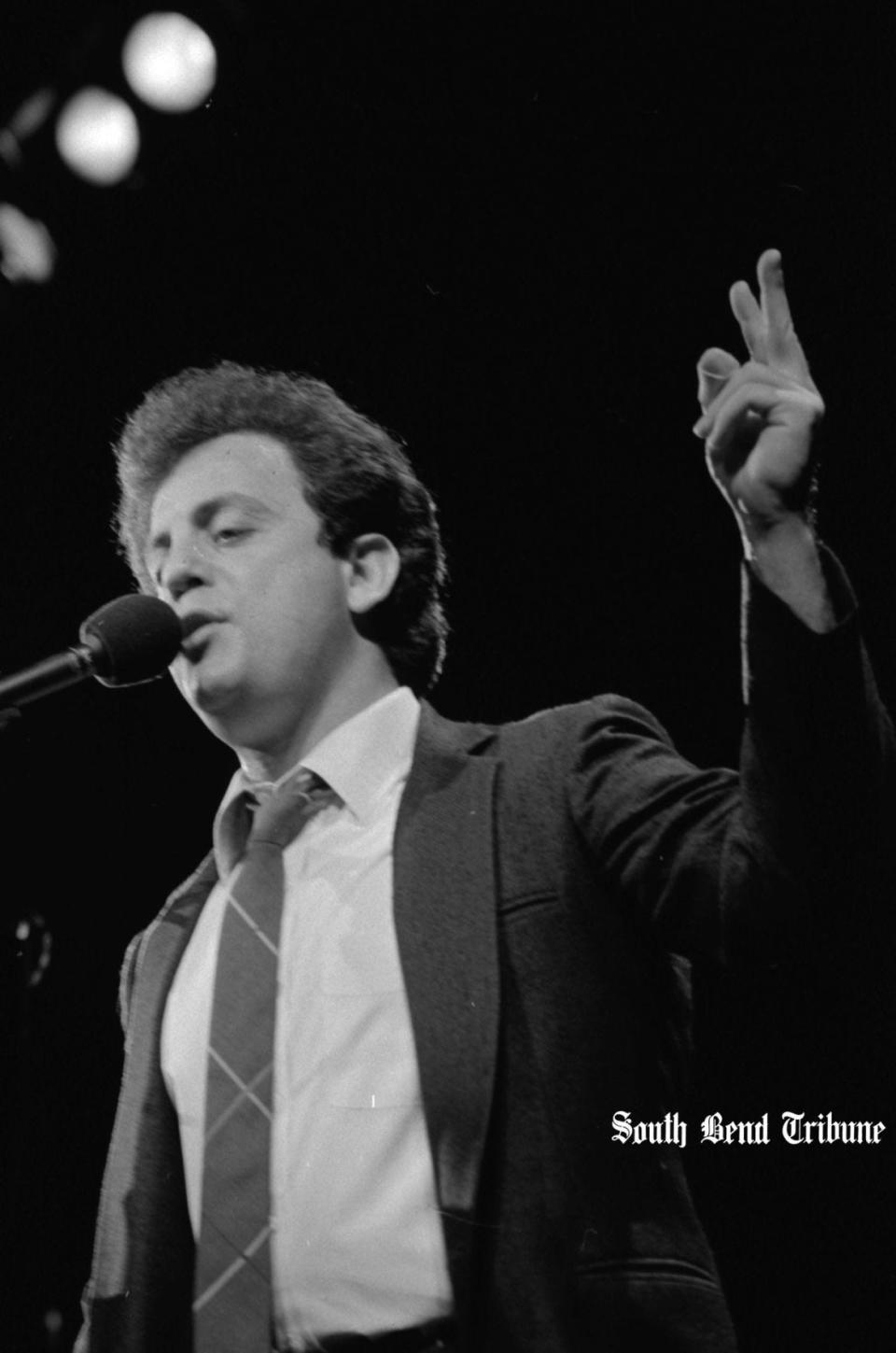 Singer-songwriter and pianist Billy Joel plays to a sold-out crowd in February 1984 at the University of Notre Dame's Joyce Center. Joel was joined on stage for one number by then-girlfriend (and his future wife) model Christie Brinkley.