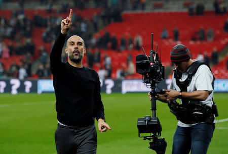 Soccer Football - Premier League - Tottenham Hotspur vs Manchester City - Wembley Stadium, London, Britain - April 14, 2018 Manchester City manager Pep Guardiola celebrates after the match REUTERS/David Klein