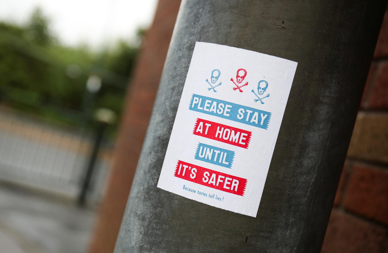 A view shows a sign advising people to stay home, amid the outbreak of the coronavirus disease (COVID-19), in Oldham, Britain, August 19, 2020. REUTERS/Molly Darlington