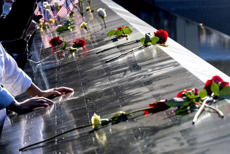 Flowers adorn the names of the victims of the attacks of Sept. 11, 2001 at the annual 9/11 Commemoration Ceremony in New York City in 2021. On Thursday, the White House called for Americans to solemnly observe the date with prayer and contemplation. File Photo by Craig Ruttle/UPI