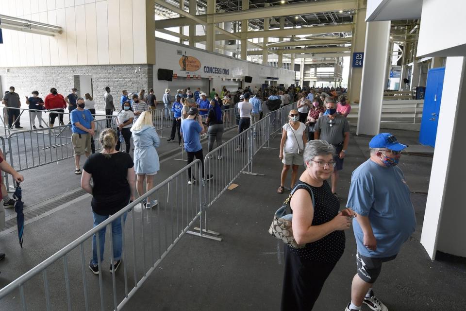 Voters  wait  in line to cast their ballots in the Kentucky primary at Kroger Field in Lexington.  