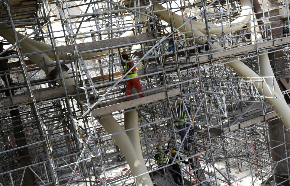 In this Oct. 8, 2019, photo, laborers work on the Al Wasl Dome at the under construction site of the Expo 2020 in Dubai, United Arab Emirates. The preparations for Expo 2020 come as Dubai’s real estate market show signs of faltering amid global economic woes. Fears of military conflict across the Persian Gulf cloud organizers’ sunny projections. (AP Photo/Kamran Jebreili)
