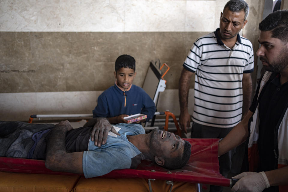 A Palestinian wounded in Israeli bombardment of the Gaza Strip is brought to a hospital in Khan Younis, Monday, Nov. 6, 2023. (AP Photo/Fatima Shbair)