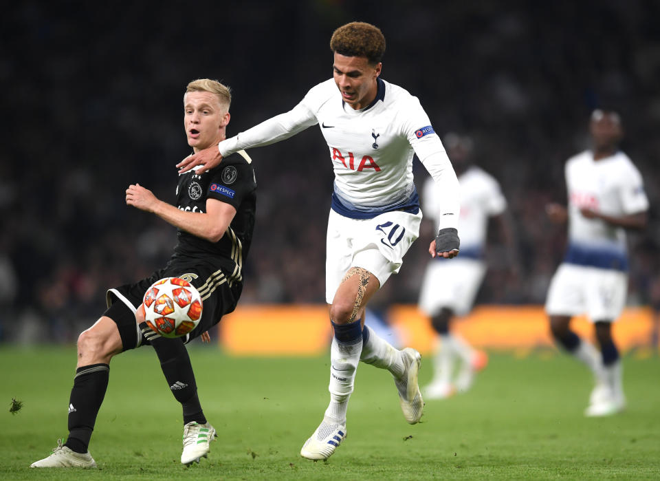 Dele Alli of Tottenham Hotspur holds off Donny van de Beek of Ajax during the UEFA Champions League Semi Final first leg match between Tottenham Hotspur and Ajax