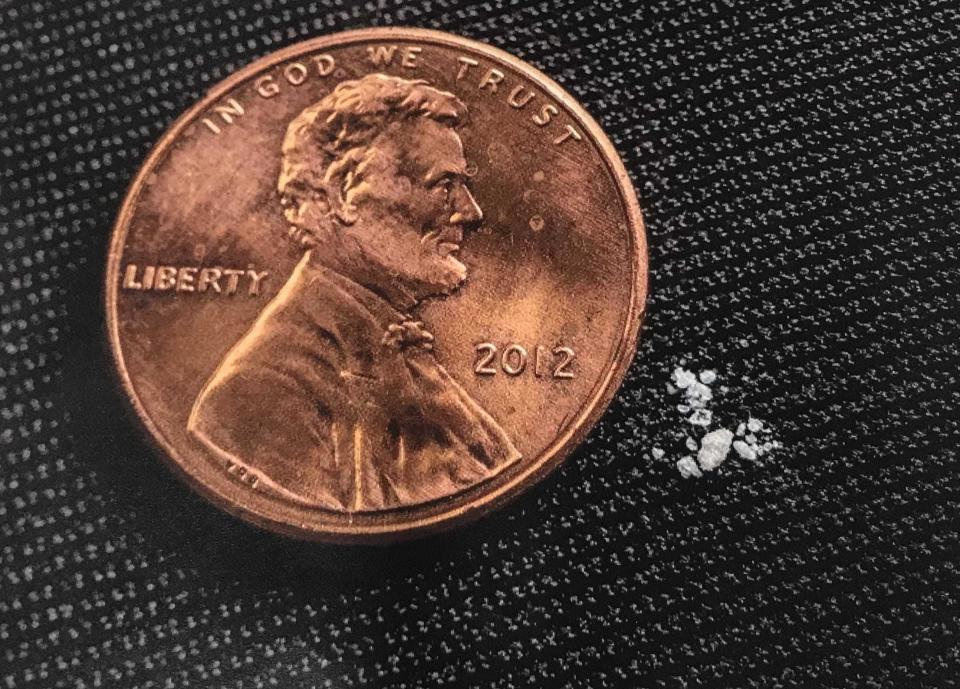 The fentanyl shown next to this penny is a lethal dose, according to federal agents. Brorphine, a new synthetic opioid, is believed to be similarly potent.