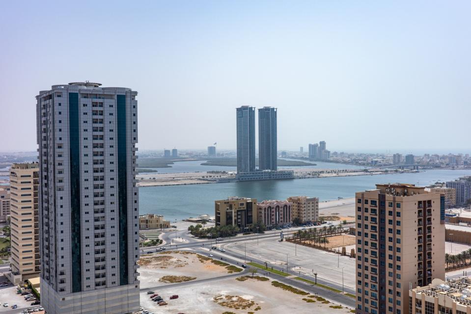 RAK Properties' Julphar Towers residential apartments, center. RAK is now pitching itself as a haven for high net worth individuals.  (Christopher Pike/Bloomberg)